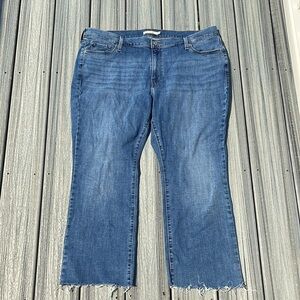 Levi’s - 415 classic boot - medium wash blue jeans - raw hem - size 22W